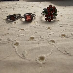Genuine ruby earrings and genuine ruby ring with flowers size six and a half..